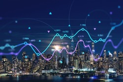 New York City skyline from New Jersey over Hudson River with skyscrapers at night, Manhattan, Midtown, USA. Forex graph hologram. The concept of internet trading, brokerage and fundamental analysis