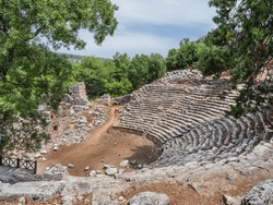 Ruins of amphitheatre in ancient Phaselis city. Panorama view on famous architectural landmark, Kemer district, Antalya province. Turkey.