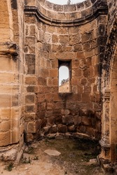 View from Inside Severely Abandoned and Ruined Gothic Saint Mamas Cathedral to Oriel Made of Calcareous Stones with Arched Bow Window and Collapsed Roof (Ajos Cypr, Agios Sozomenos, Nicosia, Cyprus)