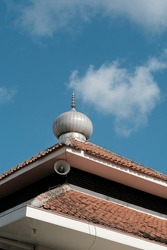 simple mosque dome, against a blue sky background