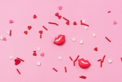 Colorful Candy Sprinkles in Shape of Hearts and Lips on Pink Background Horizontal