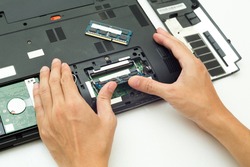 Hand push RAM is changing for Laptop computer,Repair concept.