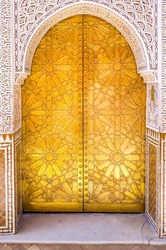 Old ornate golden door in the medina of Marrakesh, Morocco, North Africa