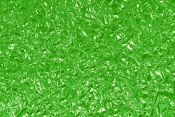 Green lime foil shiny texture, abstract wrapping paper for background and design art work.