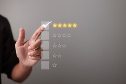 Hand touching and giving five yellow stars indicates the highest level of customer satisfaction and evaluation for a high-quality product and service.