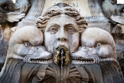 A detail shot of one of the sculptures that are part of the fountain at the Pantheon in Rome, Italy.