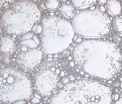 Full frame of the textures formed by the bubbles and drops in the shape of circle floating