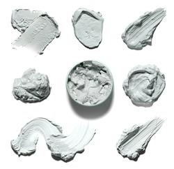 Various smear of facial mud on a white background. Texture of clay mask isolated on white