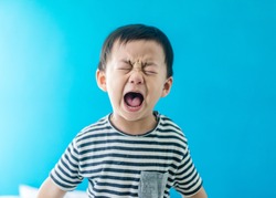 Emotional Tantrum and Angry little boy at home.Stay at home self quarantine at home from covid-19 coronavirus.Depressed toddler complaining.Attention deficit hyperactivity disorder (ADHD) Concept.