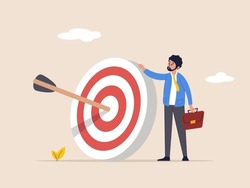 Achieve goal concept. Aspiration and motivation. Business objective, purpose or target, goal and resolution to aim for success. confident businessman stand with arrow hit bullseye on archery target.