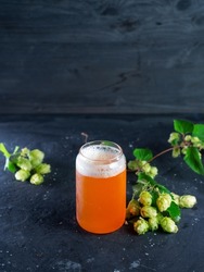 Indian pale ale, a glass of craft beer and green hops
