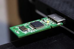 Data recovery from flash drive and NAND component. Flash drive component being plugged into a computer to recover and extract data directly from memory chip.