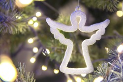 white figure of a Christmas angel on a tree