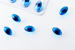 Blue Gel Painkiller Capsules on white background