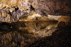 Reflection in underground lake. Baradla cave in Aggtelek, Hungary