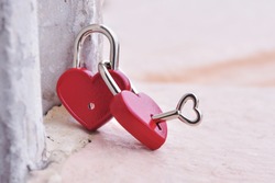 Couple red heart lock with key  lean against vintage pole, valentine love symbol