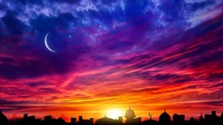 Crescent moon with beautiful sunset background . Generous Ramadan . Light from sky . Religion background .  city silhouette mosque