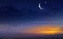 Muslim half moon and beautiful sunset .Sunset over the city . Light in dark sky . beautiful cloud . Ramadan background .  Mubarak background . Prayer time .  Dramatic nature background . Arab night   