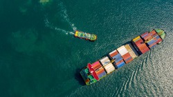 Aerial view of International Containers Cargos ship,Freight Transportation, Shipping,Trade Port,Shipping cargo to harbor, Nautical Vessel.Logistics import export Container Cargo ship over sea business