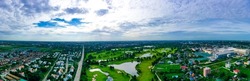 Aerial view of dramatic sunset or sunrise and colorful sky over golf field Bangkok Thailand. bird eye view over Golf course in the tropical Bangkok city skyline and beautiful colorful clouds sky. 