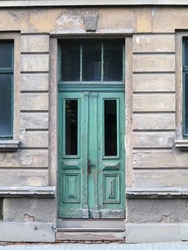 Weathered wooden door in old ruin building