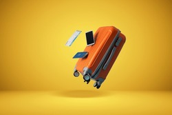	
suitcase with yellow background and empty space for text shades of yellow background