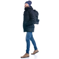 Man in winter jacket and warm hat, with backpack walking goes on white background isolation