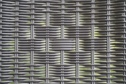           synthetic rattan weaving on plastic chair                     