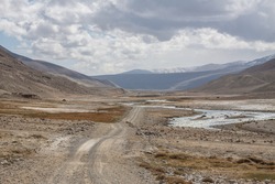 Road in Pamir River valley on the Afghan and Tajik borderline