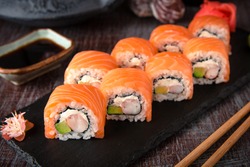 Philadelphia roll sushi with salmon, prawn, avocado, cream cheese. Sushi menu. Japanese food. 
