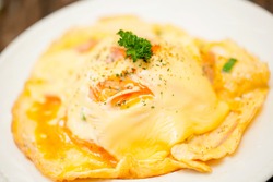 Omelette with  cheese on the Plate ,soft focus