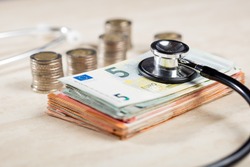 still life stethoscope with euro banknotes