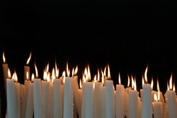White Candle flames on a black background