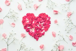 Heart shape made of flowers on white background.Flat lay. Valentines,love and wedding concept ideas