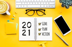 2021 new year goal,plan,action concepts with text on notepad and office accessories.Business management,Inspiration to success ideas