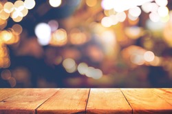 Empty of wood  table top with  blurred light gold bokeh abstract background.For montage product display or design key visual layout