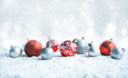 Christmas ball (ornament) on snow background.For christmas day concepts or new year,celebration ideas.copy space
