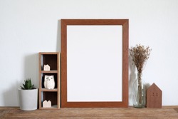 mock up frame on wooden shelf.home decoration 