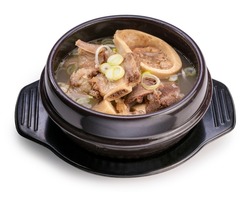 Beef bone marrow soup in hot iron pot Beef bone marrow isolated on white background, Beef Stock Bone soup or Seolleongtang in iron pot on white With clipping path.