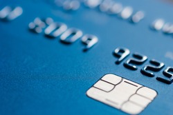 Credit card in blue with chip close up atm emv blurred