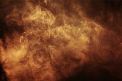 Abstract colored smoke on a dark background