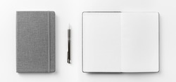 Business concept - Top view collection of  grey notebook front, back pen, and white open page isolated on background for mockup