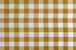 Checkered tablecloth for the table beige and white cells pattern. Background texture of brown textile napkin. Plaid fabric. macro. Abstract wine backdrop.