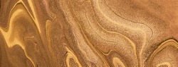 Abstract fluid art background dark golden and copper colors. Liquid marble. Acrylic painting on canvas with brown lines and gradient. Alcohol ink backdrop with glitter wavy pattern.