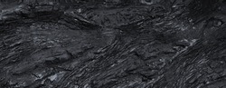 Black slate texture. Uneven rough surface, height differences. Top view