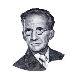 World famous physicist Erwin Schrödinger black and white portrait close up isolated on white background. Fragment of austrian banknote