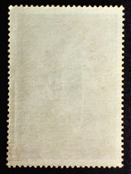 Old posted stamp with  reverse  side isilated on black background 