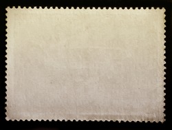 Blank vintage posted stamp isolated on black background.