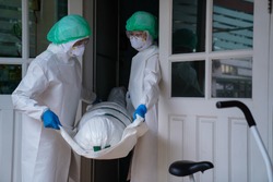 
COVID-19 DEAD: Death increases every day. Staff wrapped up the dead bodies of Coronavirus covid-19 infection