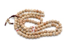 Buddhist or Hindu prayer beads isolated on white.
